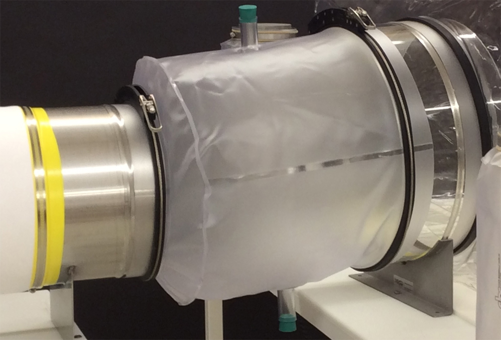 Pictured is a CBC Patent Clamp being used to connect a Standard Sterilizing Cylinder to a transfer sleeve.